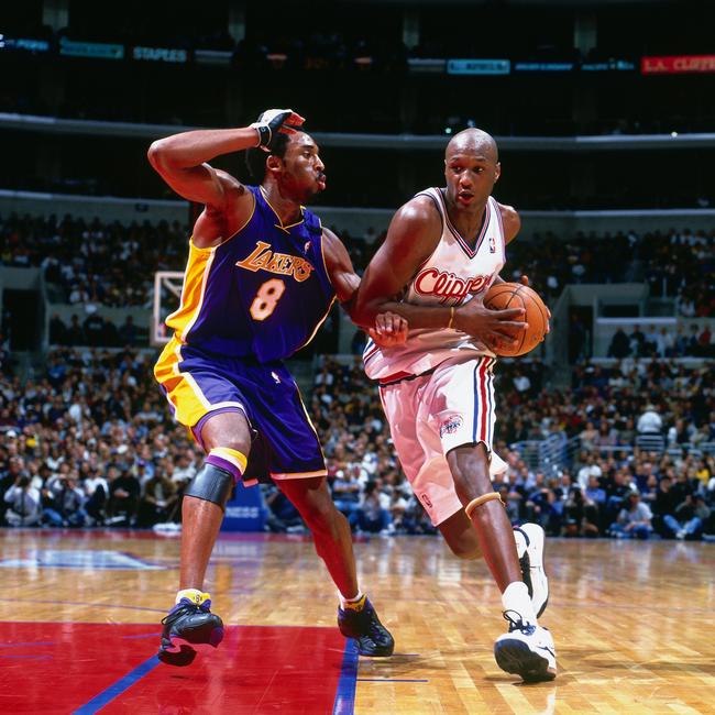 Lamar Odom of the Los Angeles Clippers drives to the basket against Kobe Bryant of the Los Angeles Lakers circa 2001 at Staples Center in Los Angeles. Picture: Getty