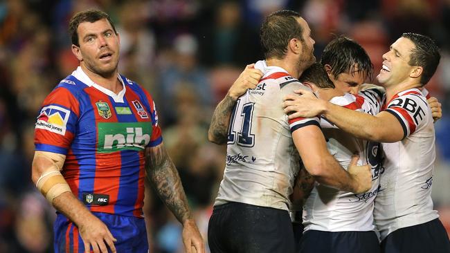 NEWCASTLE, AUSTRALIA — APRIL 14: Mitchell Pearce of the Roosters celebrates his try with team mates during the round seven NRL match between the Newcastle Knights and the Sydney Roosters at McDonald Jones Stadium on April 14, 2017 in Newcastle, Australia. (Photo by Ashley Feder/Getty Images)