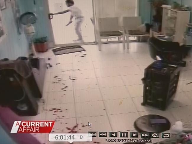 5. Bloodbath ... Terror suspect Ihsas Khan in salon doorway as terrified clients flee. Picture: Channel 9 / ACA