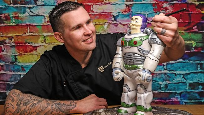 Baker and pastry chef, Dan Greensill with his Buzz Lightyear cake he has created and is entering in the 2022 Ekka Cake Contest. Picture: Zak Simmonds