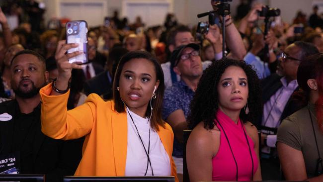 Guests listen as Republican presidential candidate former President Donald Trump participates in a question and answers session at the National Association of Black Journalists (NABJ) convention.