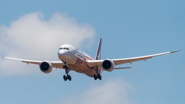 Flight QF110 arrives at Darwin Airport ... the Boeing 787 Dreamliner is fittingly painted with a design showcasing the artwork of senior Northern Territory Anmatyerre artist, Emily Kame Kngwarreye. Picture: Che Chorley