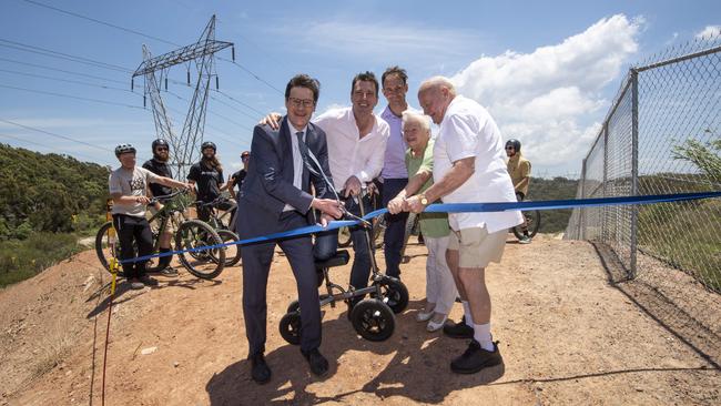 From left Member for Davidson Jonathan O'Dea, Michael Regan, Mayor Northern Beaches Council, Peter Graham Chief Executive Waste Assets Management Corporation, June and Malcolm Dawes photographed cutting the ribbon to officially open the world class bike park in Belrose on Thursday, 10 December 2020. Picture / Monique Harmer