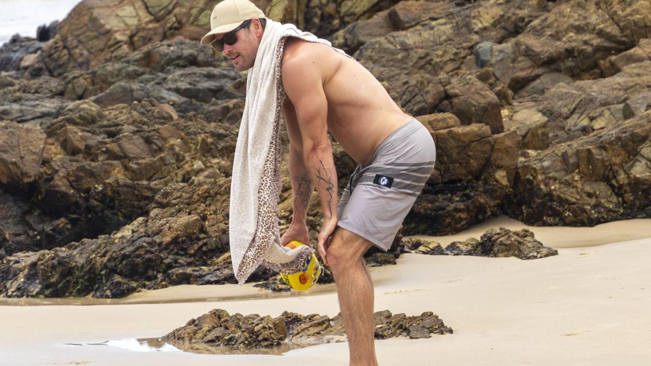 Hemsworth dried himself off with a very masculine leopard print towel. Picture: Media Mode.