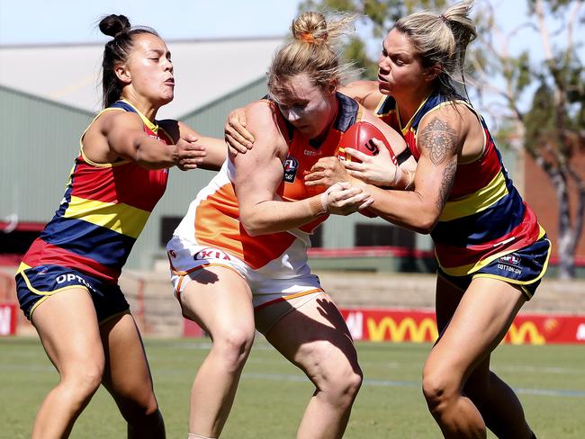 Justine Mules, left, and Anne Hatchard combine to bring down Giants’ Tait Mackrill during the 2020 season. Picture: Sarah Reed