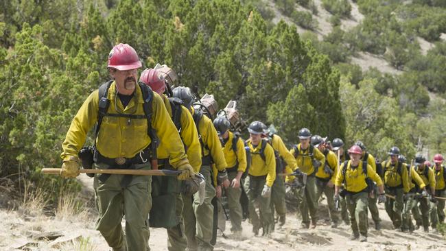 "Supe" Eric Marsh (Josh Brolin) leads the Granite Mountain Hotshots up the trail at Yarnell Hills--including, generally in this order: Travis Carter (Scott Foxx), Dustin Deford (Ryan Busch), Garret Zuppiger (Brandon Bunch), Andrew Ashcraft (Alex Russell), Wade Parker (Ben Hardy), Scott Norris (producer Thad Luckinbill), Anthony Rose (Jake Picking), Travis Turbyfill (Geoff Stults), Chris MacKenzie (Taylor Kitsch), Brendan McDonough (Miles Teller), Joe Thurston (Matthew Van Wettering), Kevin Woyjeck (Michael McNulty), Grant McKee (Sam Quinn), Billy Warneke (Ryan Jason Cook), John Percin, Jr. (Nicholas Jenks), Sean Misner (Kenny Miller), Robert Caldwell (Dylan Kenin), Clayton Whitted (Scott Haze), Jesse Steed (James Badge Dale) in Columbia Pictures' ONLY THE BRAVE, THE TRUE STORY OF THE GRANITE MOUNTAIN HOTSHOTS.