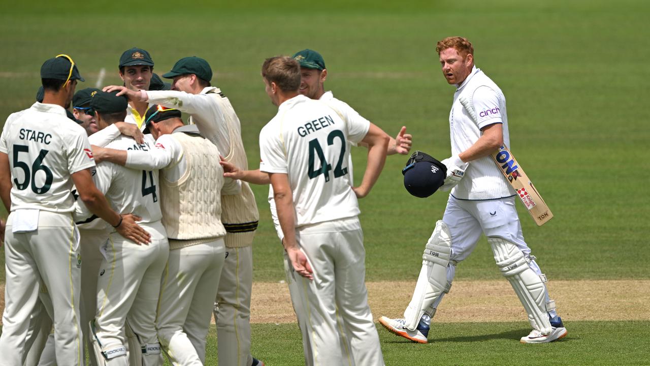 England batsman Jonny Bairstow leaves the field past the celebrating Australia fielders. (Photo by Stu Forster/Getty Images)