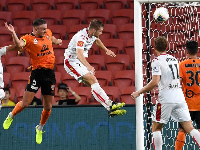 Tom Aldred of the Roar (2nd left) scores a goal during the Round 18 A-League match between Brisbane Roar FC and Adelaide United at Suncorp Stadium in Brisbane, Saturday, February 8, 2020. (AAP Image/Dan Peled) NO ARCHIVING, EDITORIAL USE ONLY