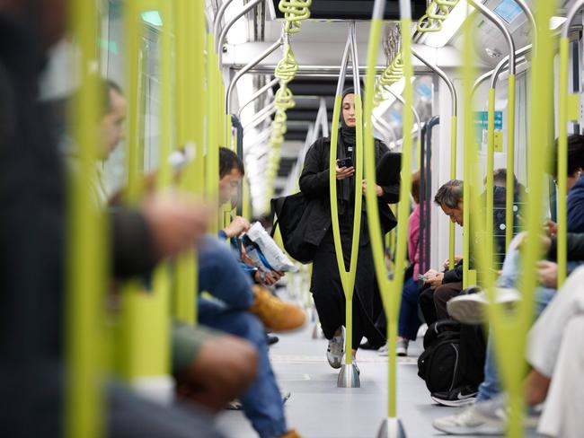 SYDNEY, AUSTRALIA - NewsWire Photos. August 19 2024. Commuters ride a metro train on the opening day of the Sydney Metro. Picture: NewsWire / Max Mason-Hubers