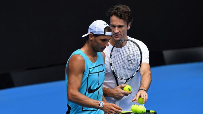 Team Nadal: Rafael and Carlos Moya. Photo: AFP PHOTO / WILLIAM WEST