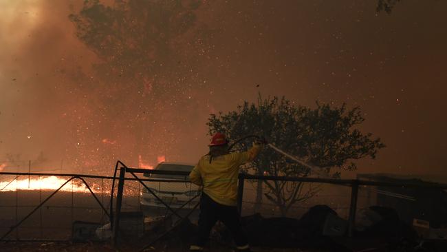 (RFS) crews battle to save homes near the town of Tahmoor as the Green Wattle Creek Fire threatens communities. Picture: AAP.