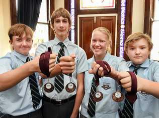 STROKE OF SUCCESS: Maryborough State High Year 10 quad rowing team Chris Bowman, Jack Pietz, Georgie Blyth and Joshua Reid with their Head of the River medals. Picture: Alistair Brightman