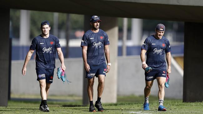 Nick Davis (centre) has been on the Roosters coaching staff.