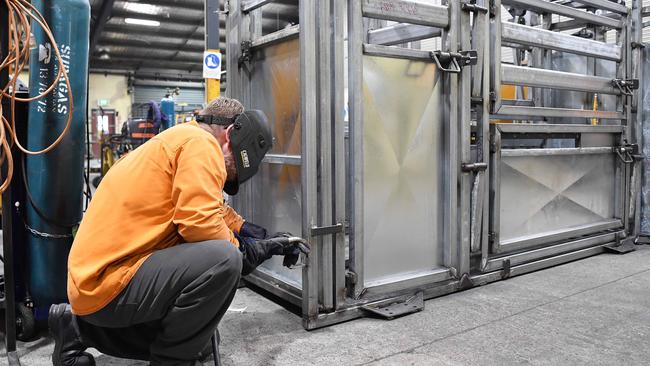 A prisoner welds a cattle crush at the Woodford Correctional Centre. Picture: Patrick Woods.