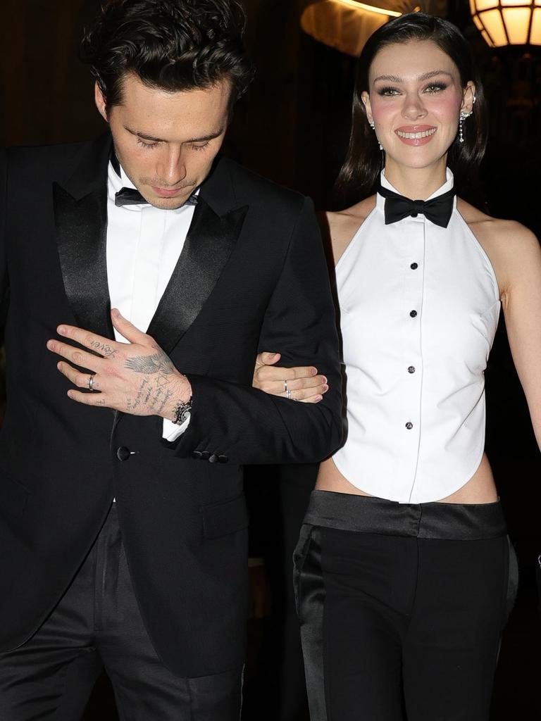 Brooklyn, 25, and Nicola, 29, stepped out in Paris during fashion week in striking, matching tuxedo-inspired looks. Picture: SPLASH / BACKGRID