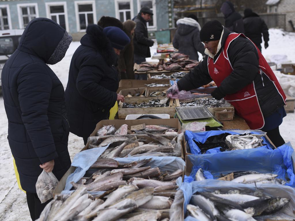 A Saturday fish market in Milove town at the border between Ukraine and Russia, Luhansk region, eastern Ukraine. Picture: Evgeniy Maloletka/AP