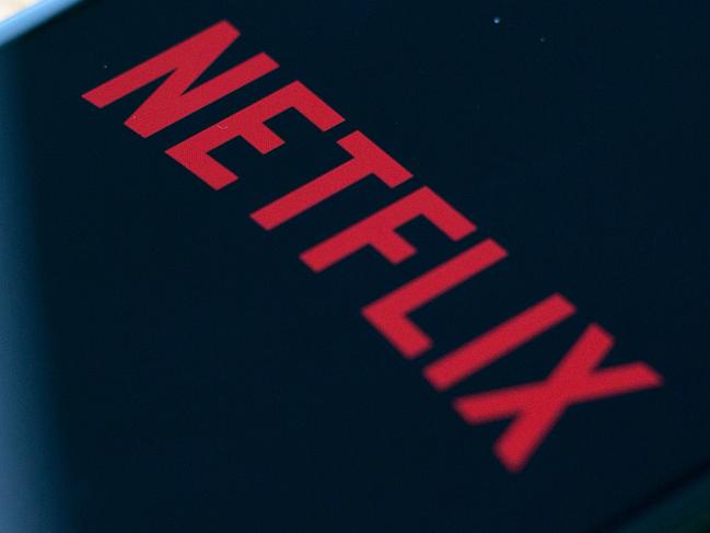 (FILES) In this file photo taken on July 10, 2019 the Netflix logo is seen on a phone in this photo illustration in Washington, DC. - Netflix said jANUARY 21, 2020 it added millions of new subscribers globally over the past quarter as it prepared up for a tougher competitive landscape, but scaled back its outlook for early 2020. The global television streaming giant beat expectations with a profit of $587 million in the fourth quarter of 2019 as revenue rose 31 percent from a year ago to $5.5 billion. (Photo by Alastair Pike / AFP)