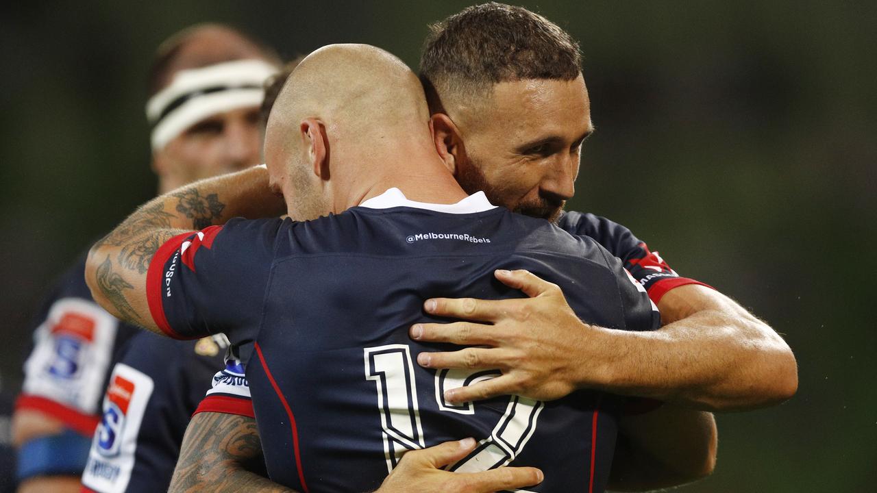 Quade Cooper of the Rebels celebrates a Billy Meakes try at AAMI Park.