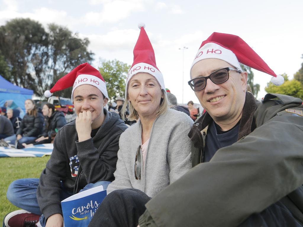 SOCIALS Oliver, 15, Claire and Ian Cuthbert of West Hobart at the Carols on the Hill, Guilford Young College, West Hobart. Picture: MATHEW FARRELL