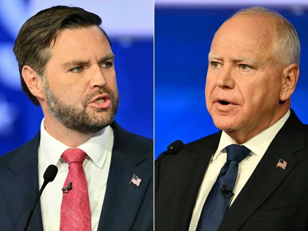 US Senator and Republican vice presidential candidate J.D. Vance (L) and Minnesota Governor and Democratic vice presidential candidate Tim Walz speak during the Vice Presidential debate hosted by CBS News in New York City on October 1, 2024