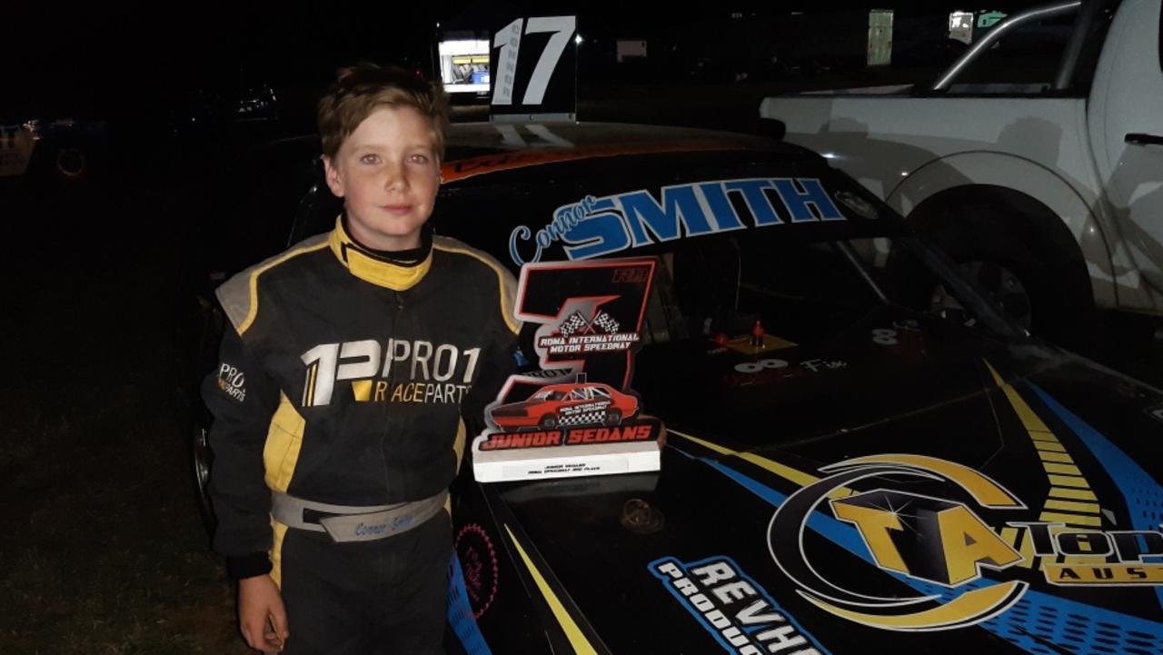 10 year old speedway racer Connor Smith from Maryborough with his 3rd place trophy and car at the Roma International Motor Speedway. Photo: Contributed/ Jennifer Smith