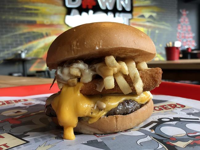 The Ape Style burger from the secret menu. The epic creation features a beef patty laden with cheese, a separate cheese patty, onion, mustard and ketchup, all topped with tiger fries.