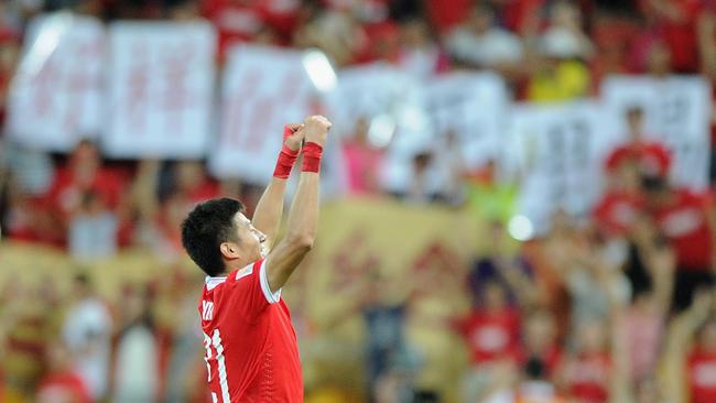 Yu Hai of China celebrates in front of a healthy contingent of Chinese fans.