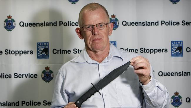 Detective Insp. John Hartwell with a knife similar to the one sort by Police in relation to the murder of Leanne Mayhew in Manoora.