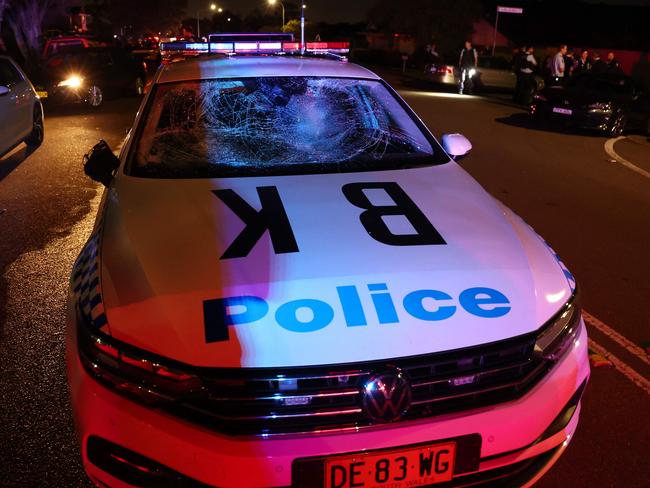 A smashed police car. Picture: David Gray/AFP