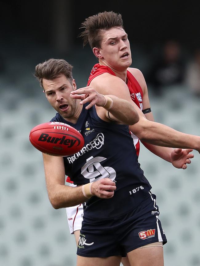 Keegan Brooksby wins the centre bounce from North’s Jordan Sweet. Picture Sarah Reed