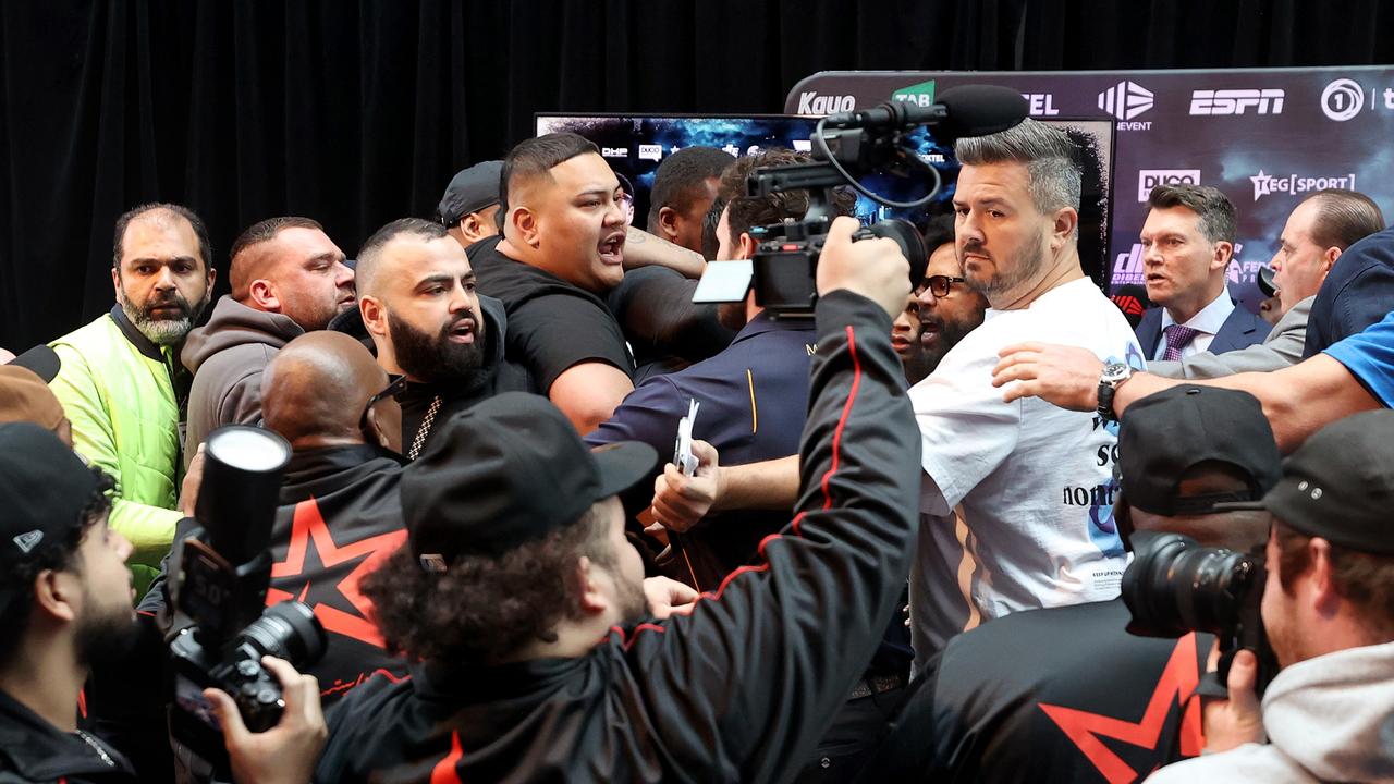 MELBOURNE, AUSTRALIA – OCTOBER 15: A scuffle breaks out during the Devin Haney and George Kambosos Jr face off during the George Kambosos Jr v Devin Haney Weigh-in at Rod Laver Arena on October 15, 2022 in Melbourne, Australia. (Photo by Kelly Defina/Getty Images)