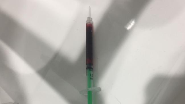 A blood-filled syringe residents allege was found in the toilets of a Miami shopping centre on the Gold Coast.