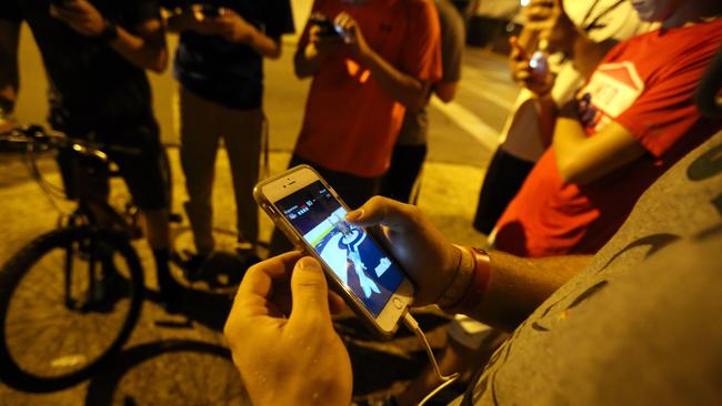 Usually a group of teenagers on bikes could mean trouble, thankfully they are just playing Pokemon Go.