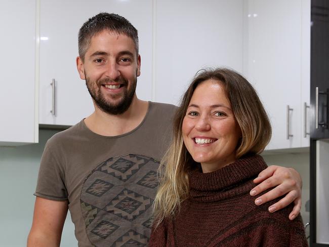 Jeff Anderson and partner Jess Sarnacki-Moyce pictured in their newly purchased unit in Botany. They were relieved they bought when they did before the market is predicted to rebound later this year. Picture: Toby Zerna