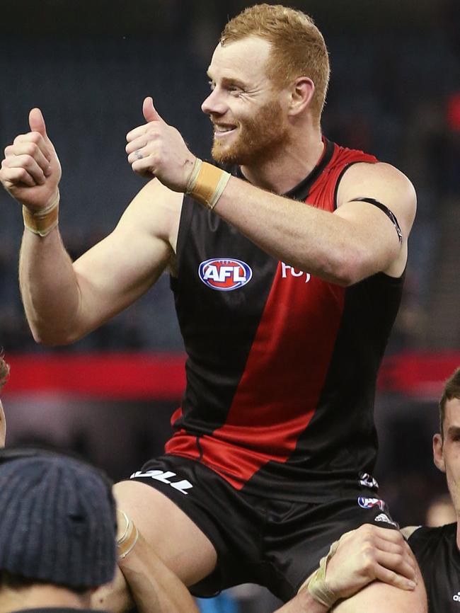 Adam Cooney gets chaired off after his final game. Picture: Michael Klein