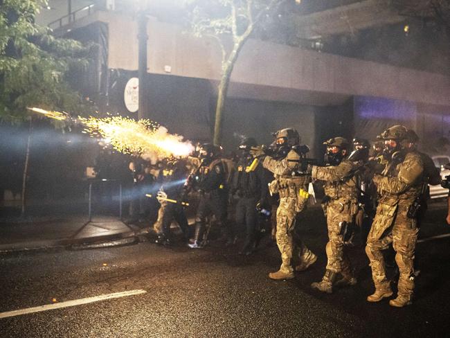 Federal officers disperse a crowd. Picture: Nathan Howard/Getty Images/AFP