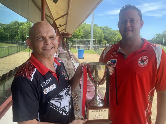 Tiwi Bombers coach Brenton Toy and Waratah mentor Ryan Ayres with the Maurice Rioli Cup. Picture: Ben Cameron.