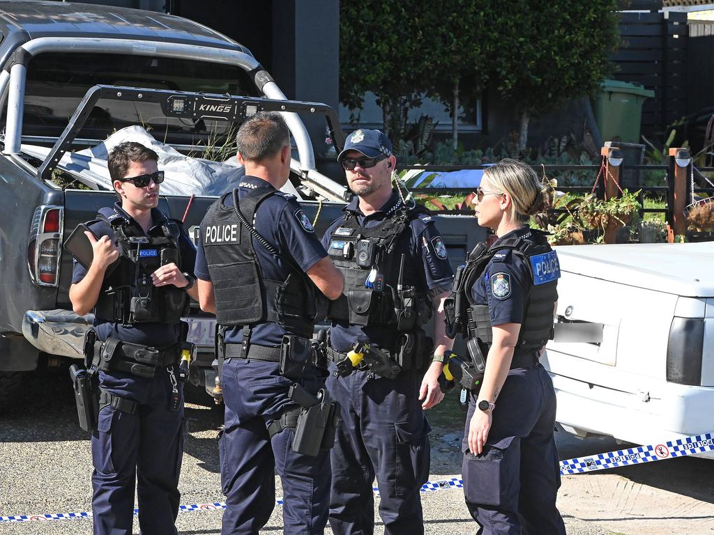 Police at the Peggy Road address where a man has been shot multiple times. Picture, John Gass