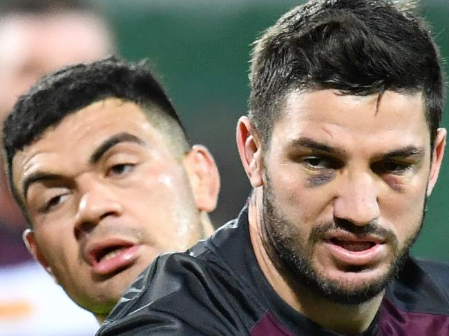 Matt Gillett (right) gets past David Fifita during training for the Queensland State of Origin team at HBF Park in Perth, Wednesday, June 19, 2019. Queensland are playing New South Wales in the 2nd State of Origin match in Perth on Sunday. (AAP Image/Darren England) NO ARCHIVING,