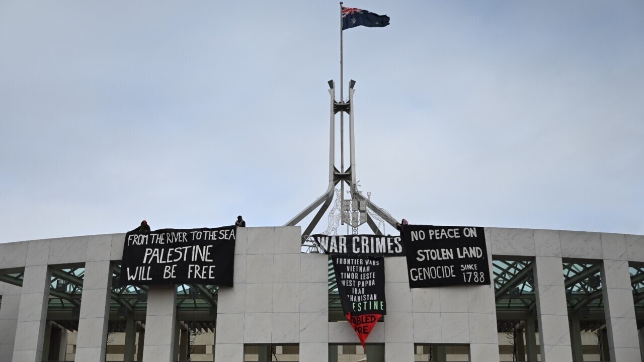 Four protesters charged with trespass after Parliament House stunt