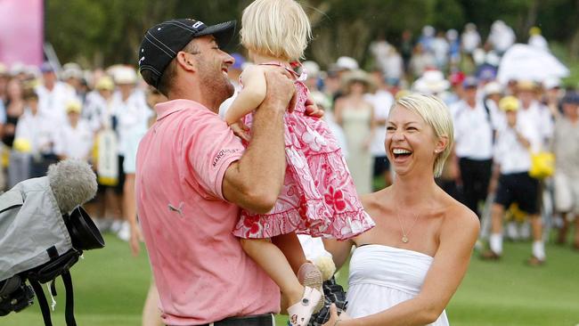 Geoff Ogilvy celebrates winning the 2008 Australian PGA with wife Juli and daughter Phoebe. Picture: Peter Wallis