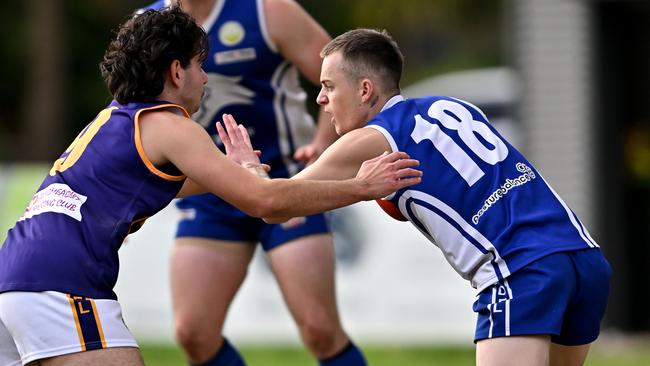 Jacana’s Benjamin Gough and Coburg Districts’ Hayden Clark. Picture: Andy Brownbill