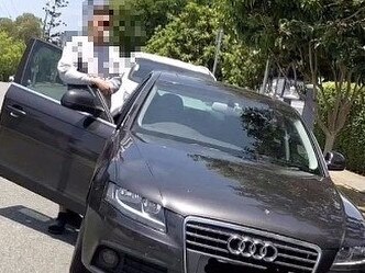 A young crim poses with a car they’ve allegedly stolen.