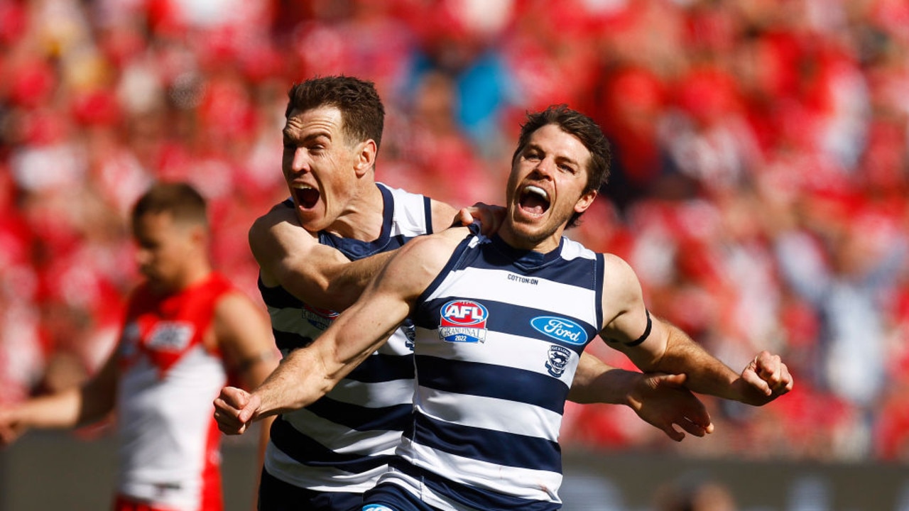 MELBOURNE, AUSTRALIA - SEPTEMBER 24: Isaac Smith of the Cats (R) celebrates kicking a goal along side Jeremy Cameron of the Cats during the 2022 AFL Grand Final match between the Geelong Cats and the Sydney Swans at the Melbourne Cricket Ground on September 24, 2022 in Melbourne, Australia. (Photo by Daniel Pockett/AFL Photos/via Getty Images)