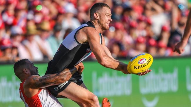 Robbie Gray gets a tackle away as he’s brought to ground by Lance Franklin. Picture: AAP