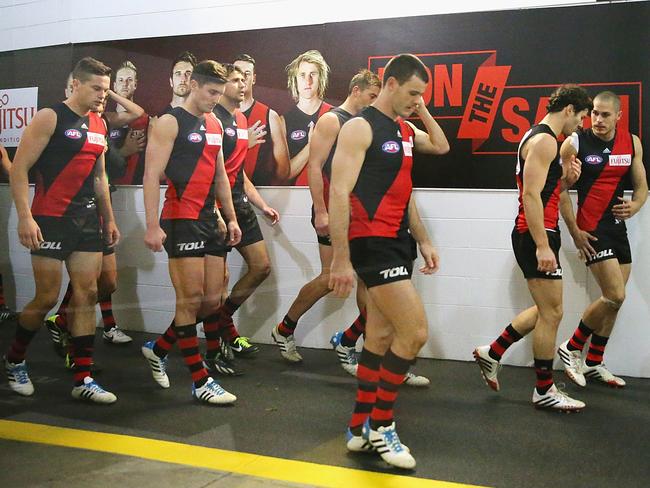 Essendon players walk off the field in 2014. Picture: Scott Barbour/Getty Images