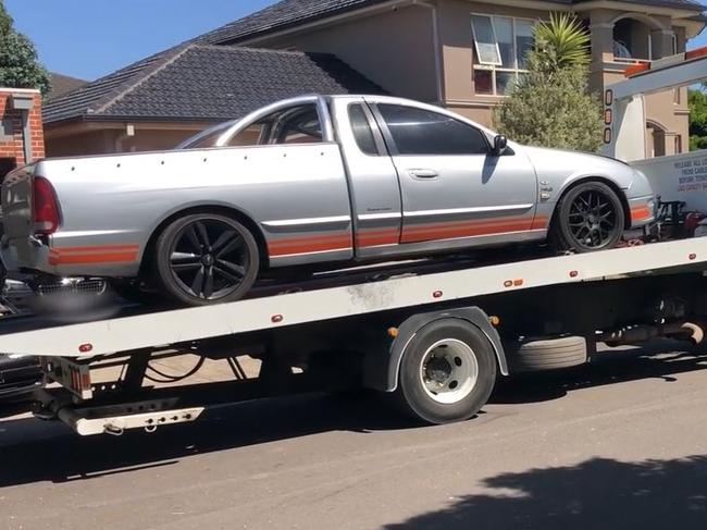 A silver Ford XR8 is towed away. Picture: Victoria Police