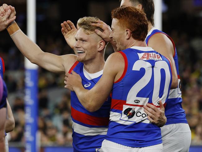 Treloar enjoys a goal with Sam Darcy and Ed Richards. Picture: Michael Klein