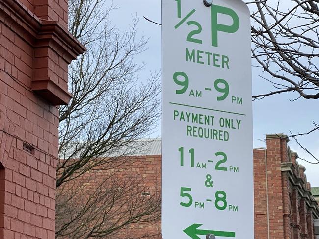 A parking meter sign on the North Hobart restaurant strip.