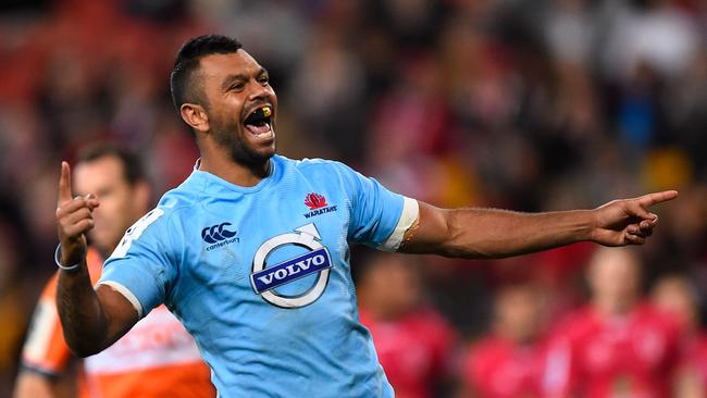 BRISBANE, AUSTRALIA - JULY 12: Kurtley Beale of the Waratahs celebrates after scoring a try during the round 19 Super Rugby match between the Reds and the Waratahs at Suncorp Stadium on July 12, 2014 in Brisbane, Australia. (Photo by Ian Hitchcock/Getty Images)